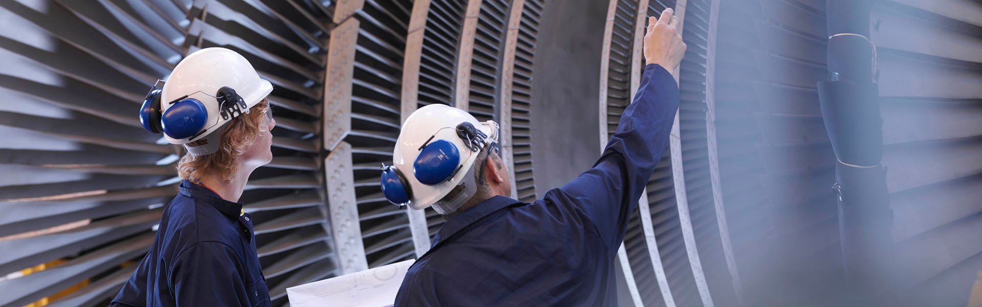 Engineers looking at turbine