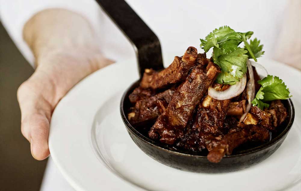 chef holding a plate